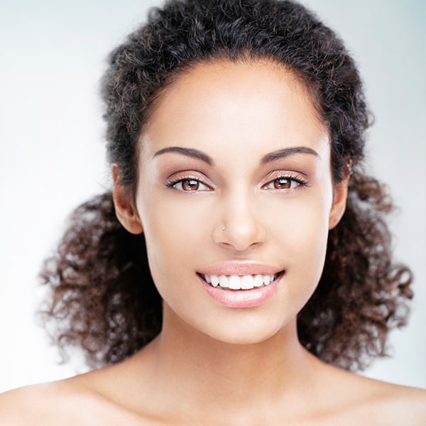 A young woman with beautiful smile smiling