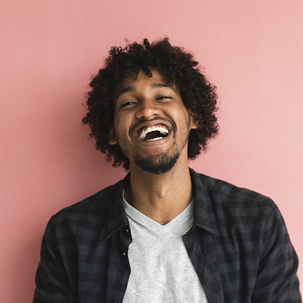 A young man laughing 